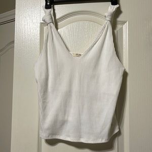 Crop top. Knotted at the shoulders. Never worn